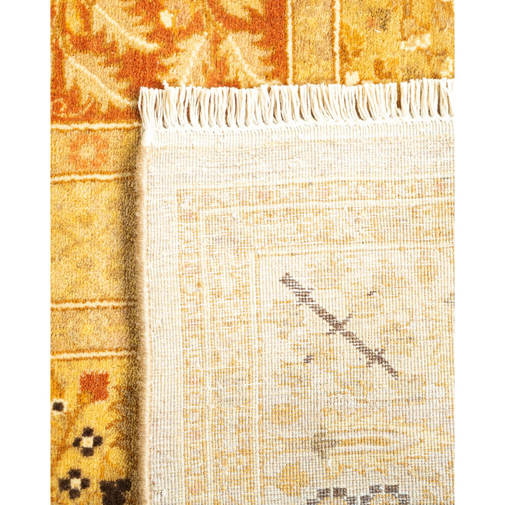 Close-up of a rug with contrasting textures and fringe detail.