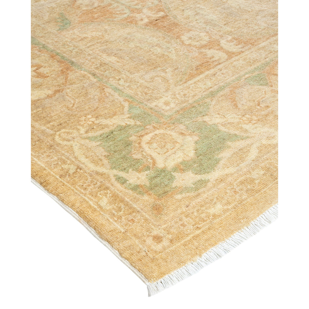 Vintage rug with faded floral pattern in beige and green.