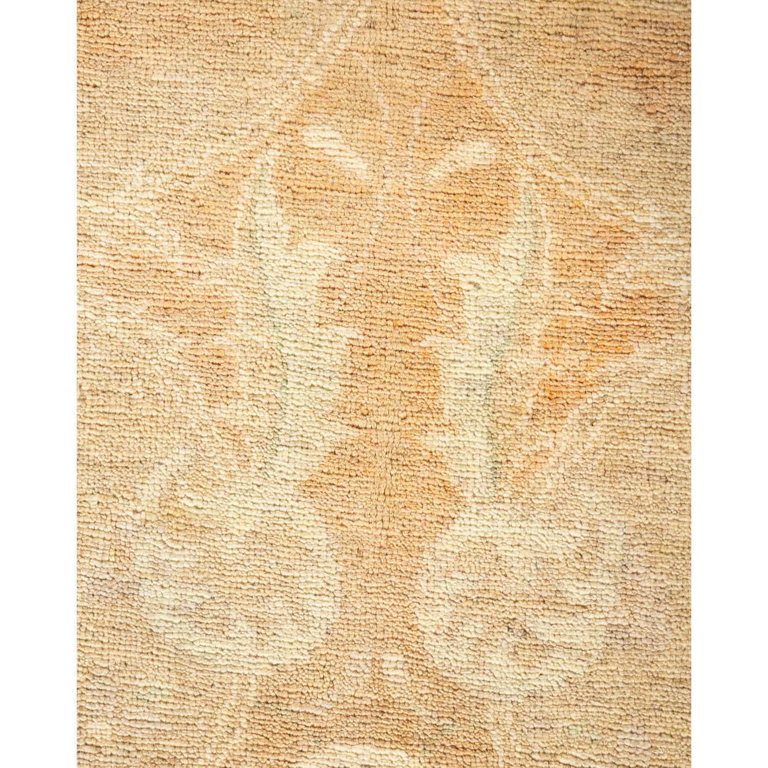 Close-up of a floral patterned rug with beige and cream tones.