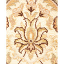 Close-up of a plush, intricately designed floral textile in earth tones.