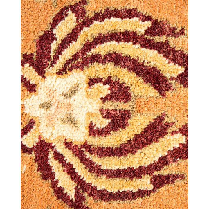 Close-up of a textured carpet with swirls and abstract shapes.