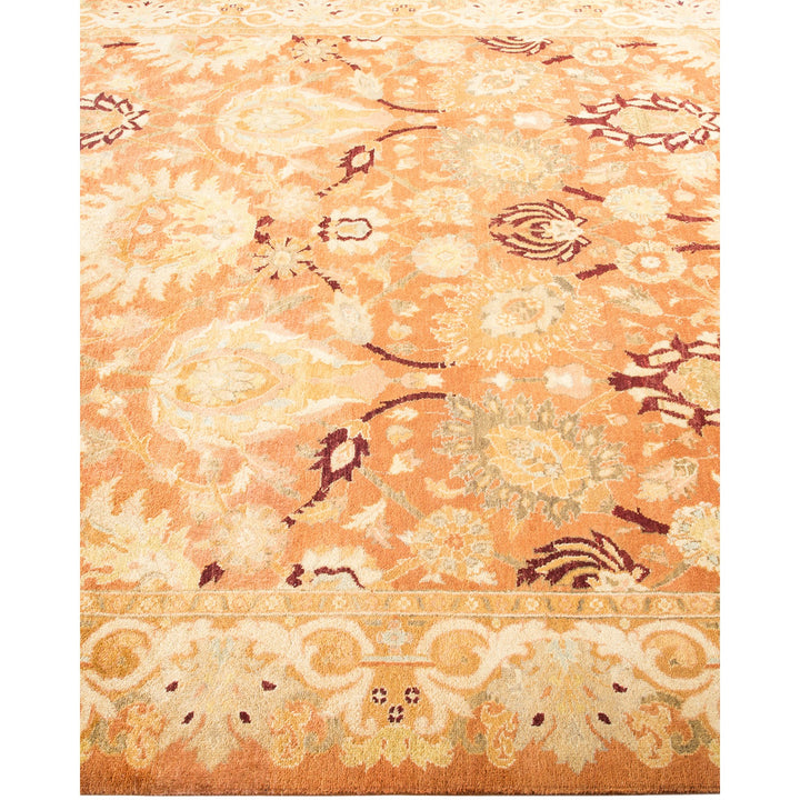 An intricate, vintage-style rug with floral motifs in muted colors.