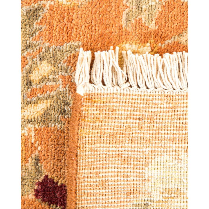 Close-up view of a textured, detailed woven rug showcasing warm colors.