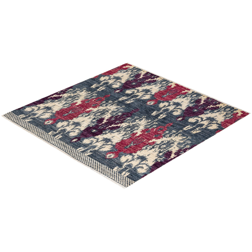 Intricately designed area rug with distressed vintage style patterns.