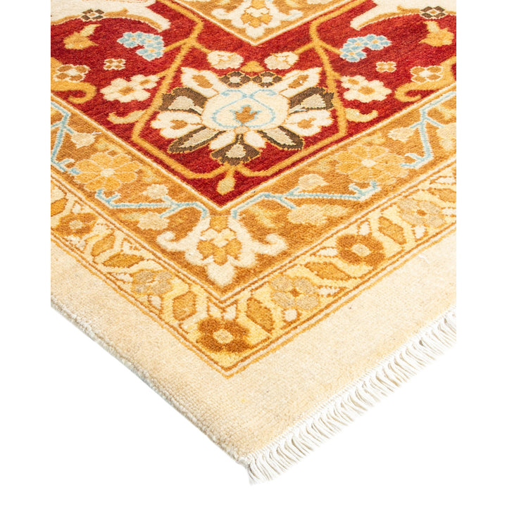 Intricate Persian-style wool rug with floral and geometric patterns.