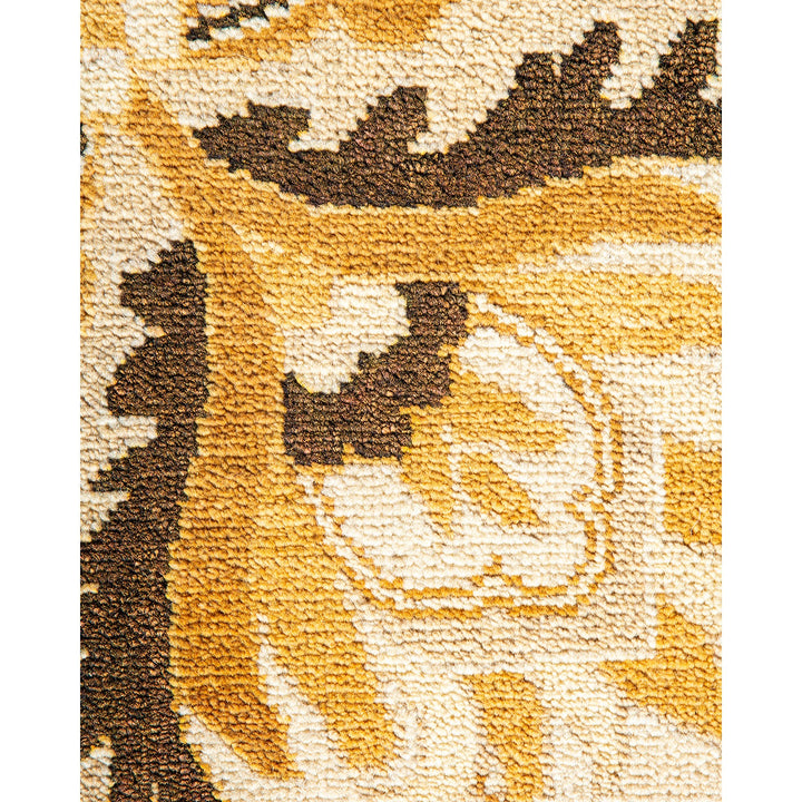Close-up of a plush, patterned textile in earthy, nature-inspired colors.