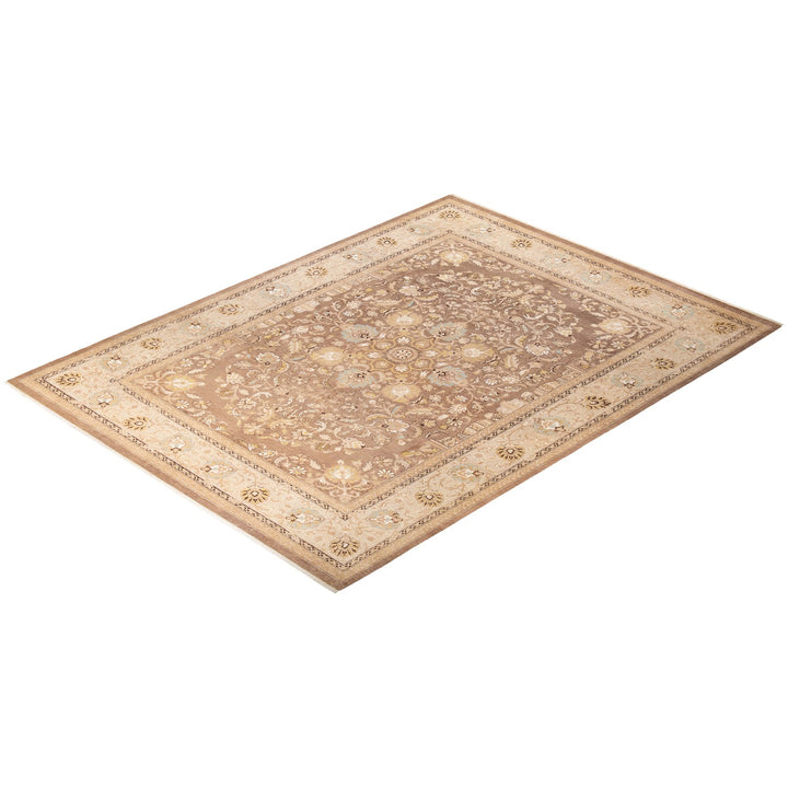 Intricate beige area rug with symmetrical floral patterns and medallion design.
