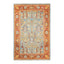 Rectangular area rug showcases intricate floral and geometric motifs.