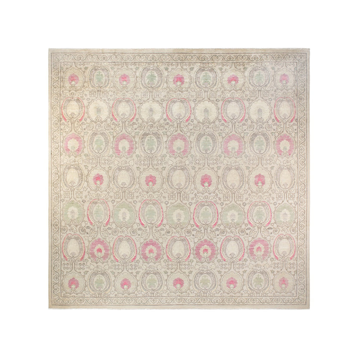 Intricate pastel rug with medallion pattern and floral motifs.