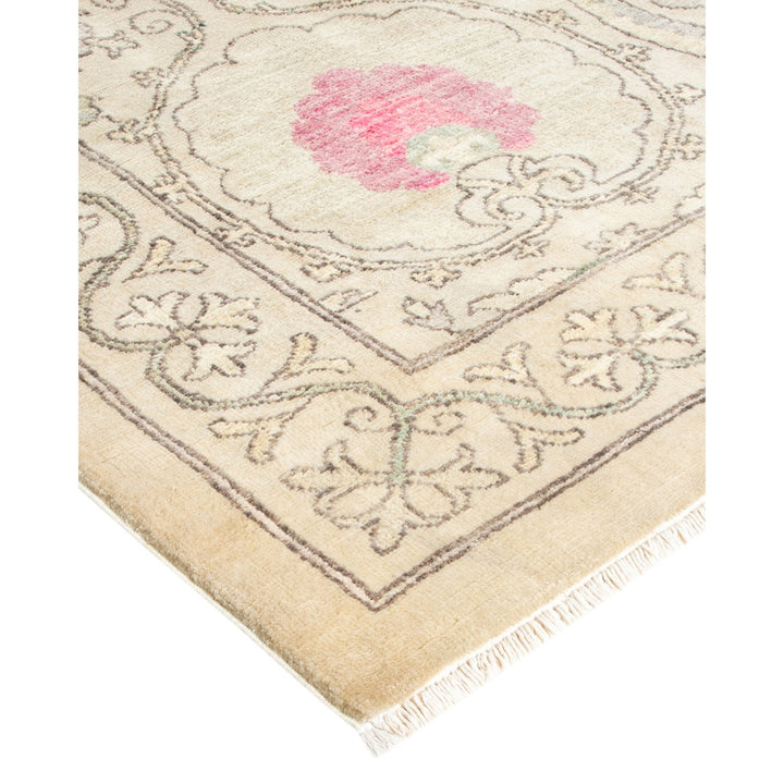 Close-up of a traditional rug with ornamental floral design.