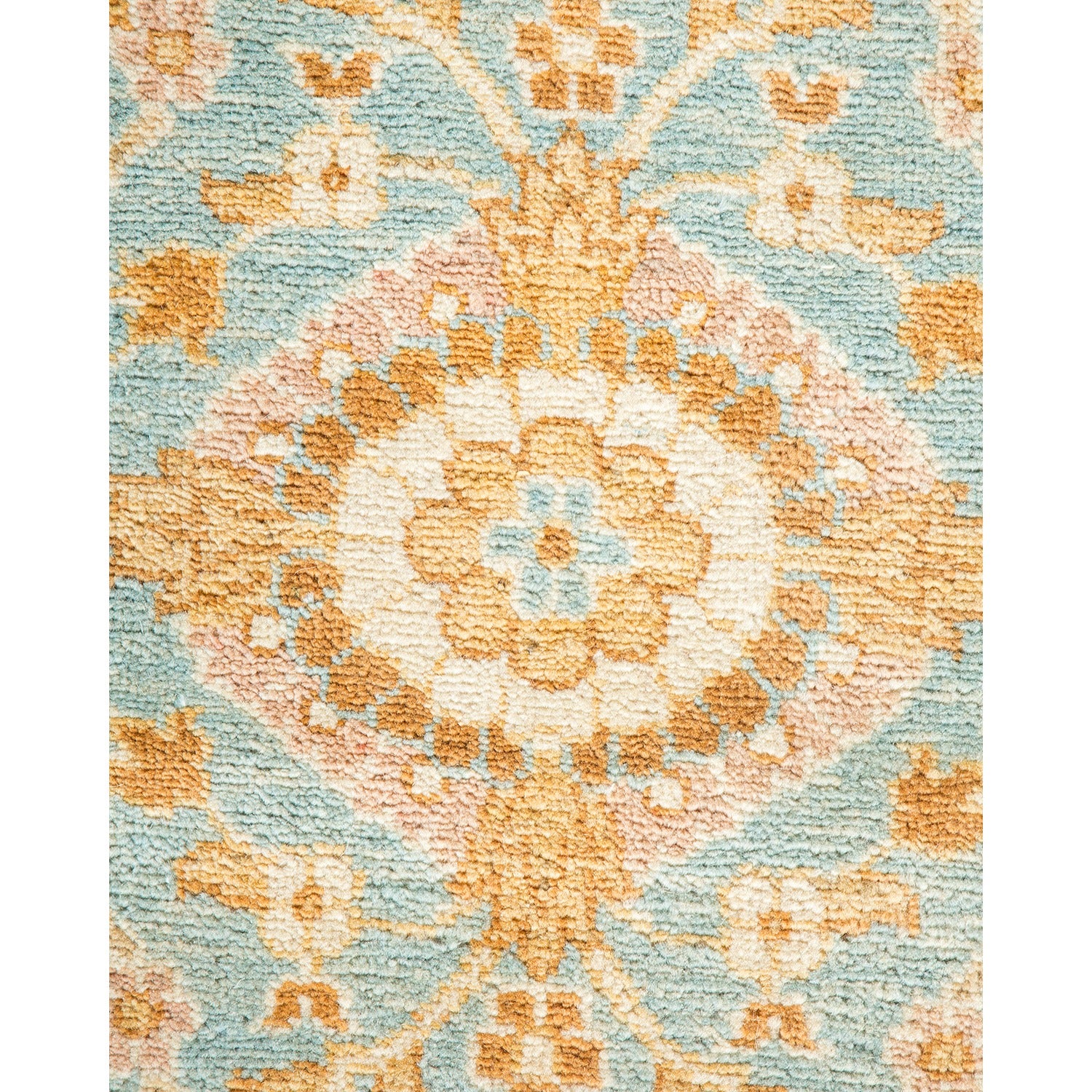 Close-up photo of a floral-patterned carpet with soft colors.