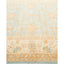 Oriental-style rug with floral and geometric motifs in pastel hues.