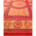 Vibrant and intricate carpet with floral and border motifs.