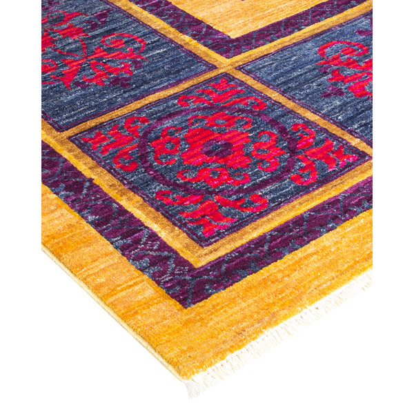 Vibrant and intricate geometric rug with golden borders and floral medallions.