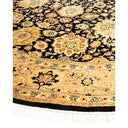 Ornate Persian-inspired rug with intricate floral motifs on dark background.