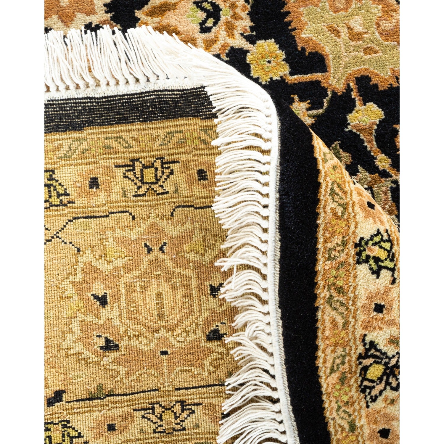 Intricate handwoven rug displays ornate floral motifs and vibrant colors.