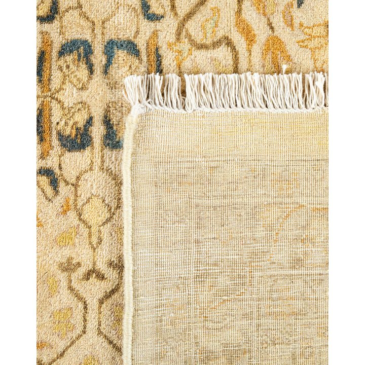 Close-up of a textile rug - plain underside meets intricate design.
