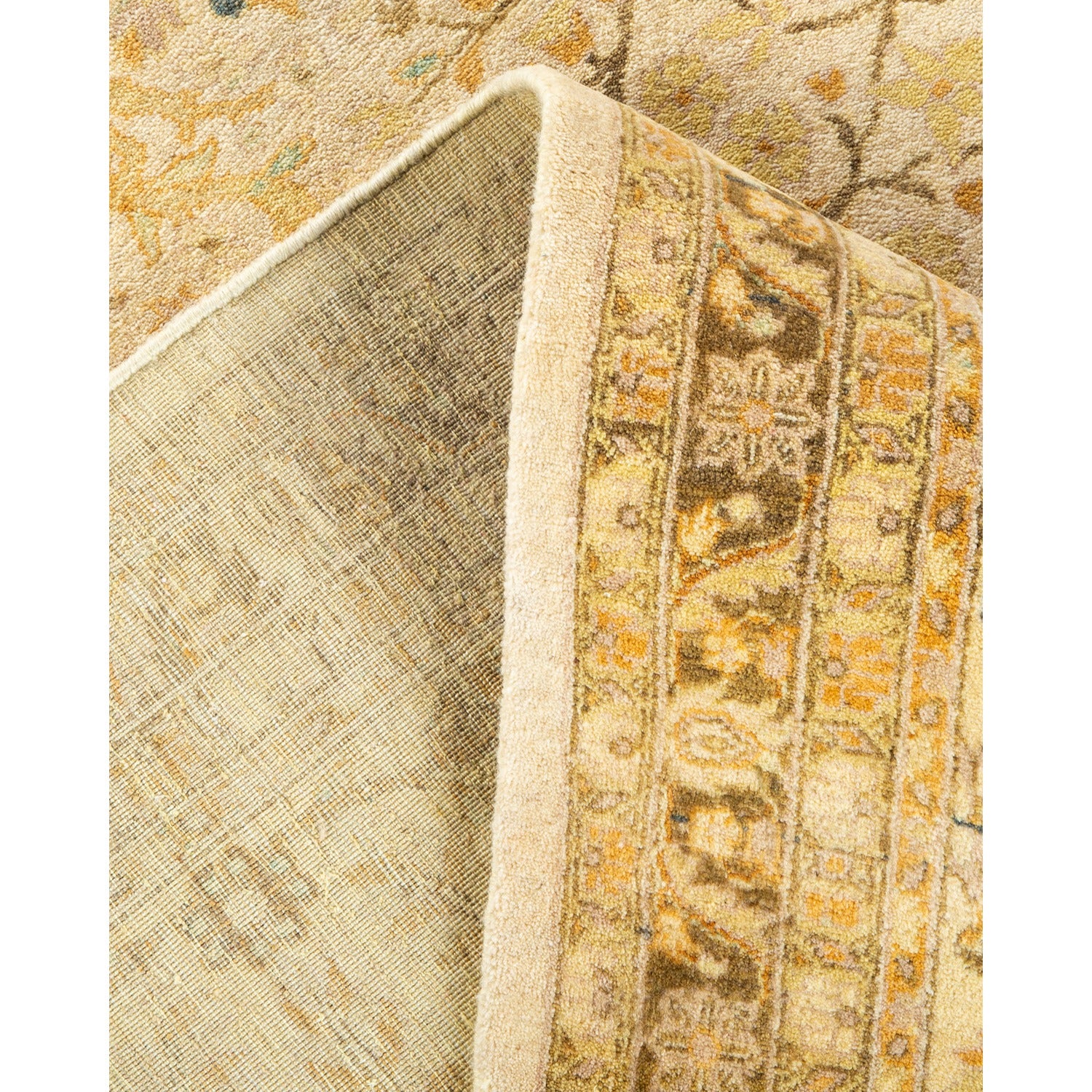 Close-up of a intricately designed, high-quality, traditional yellow-gold rug.