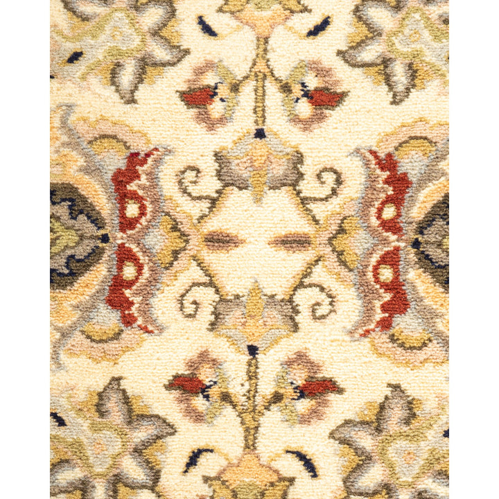 Exquisite, symmetrical rug with intricate floral motifs flaunting vibrant colors.