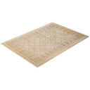 Rectangular area rug with diamond pattern and floral border design.