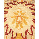 Close-up of a patterned rug with geometric and floral designs.