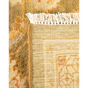 Close-up of intricately woven rug with visible texture and decorative motifs.