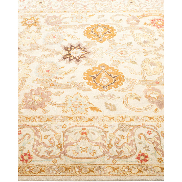 An intricately designed, high-quality carpet with soft, muted colors.