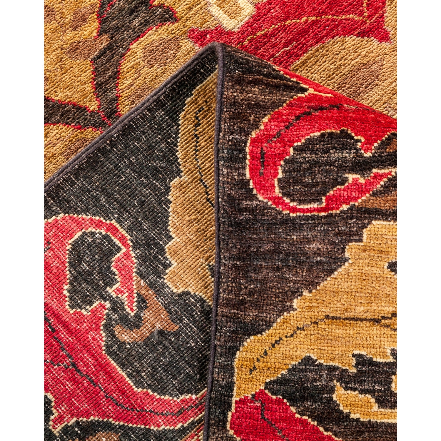 Intricate traditional carpet with folded edge showcases exquisite craftsmanship.