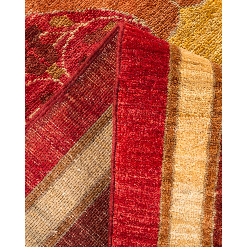 Close-up view of stacked carpets showcasing rich colors and textures.
