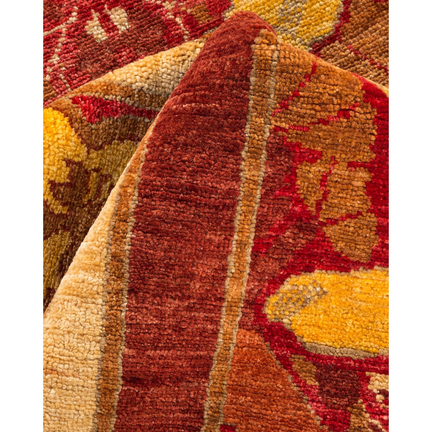Close-up of a plush, intricately patterned textile with vibrant hues.