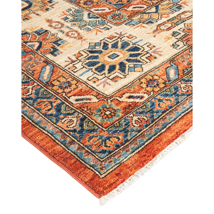 Intricately designed rug with rich colors and traditional motifs.