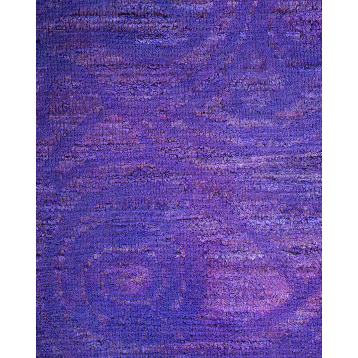 Abstract textured surface in shades of purple evokes tactile richness.