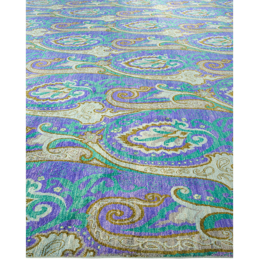 Intricate paisley-patterned carpet in rich blue and green hues.