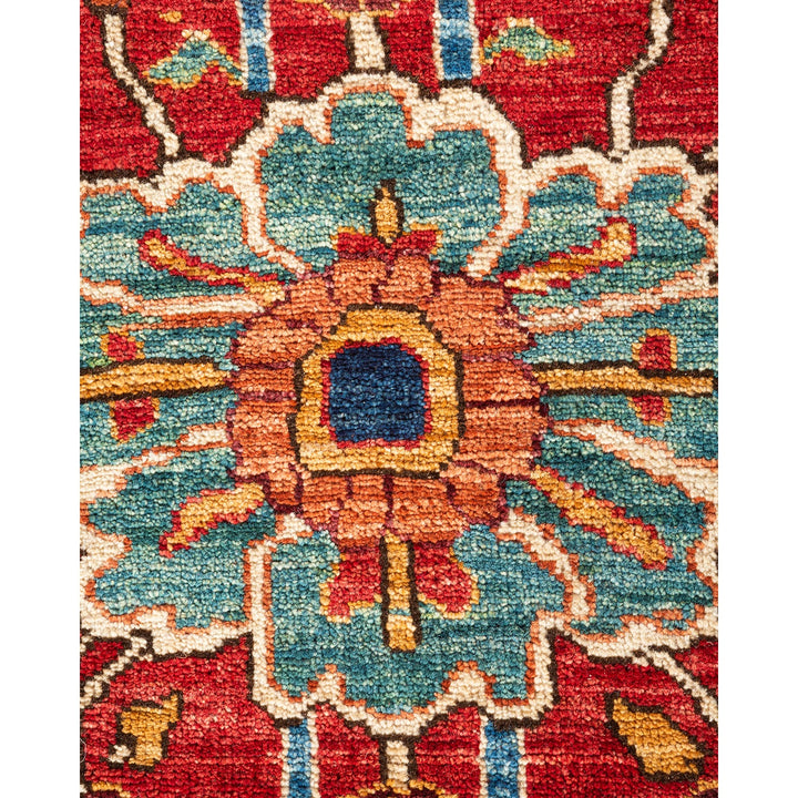 Close-up detail of a vibrant, hand-woven ornate rug or carpet.