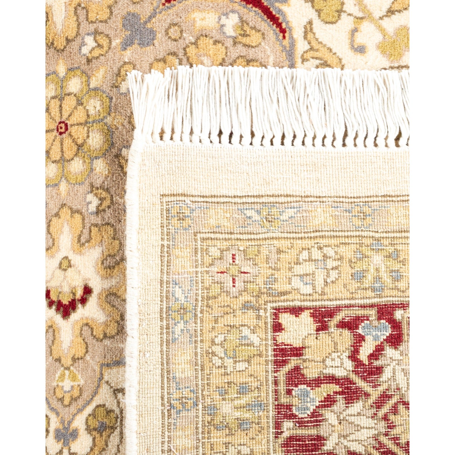 Close-up of two intricate, high-quality hand-knotted decorative rugs.