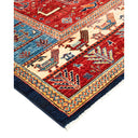 Intricately designed Oriental carpet with rich red field and geometric patterns
