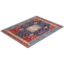 Ornate rug with rich color scheme and intricate symmetrical design.