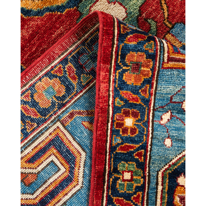 Vibrant hand-woven rug with intricate Middle Eastern-inspired patterns and fringe