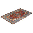 Exquisite hand-knotted Persian/Oriental rug boasts intricate designs and vibrant colors.