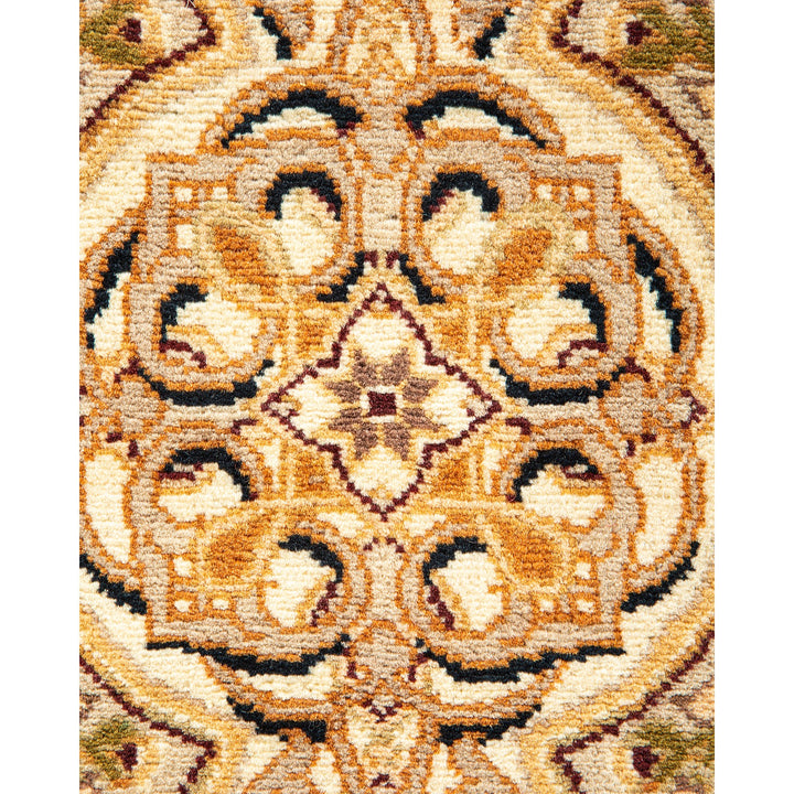 Intricate, symmetrical pattern with warm, plush texture showcases expert craftsmanship.