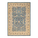 Traditional ornamental rug with intricate patterns in dominant blue and beige.
