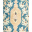 Exquisite symmetrical rug adorned with floral patterns, adding elegance to interiors.