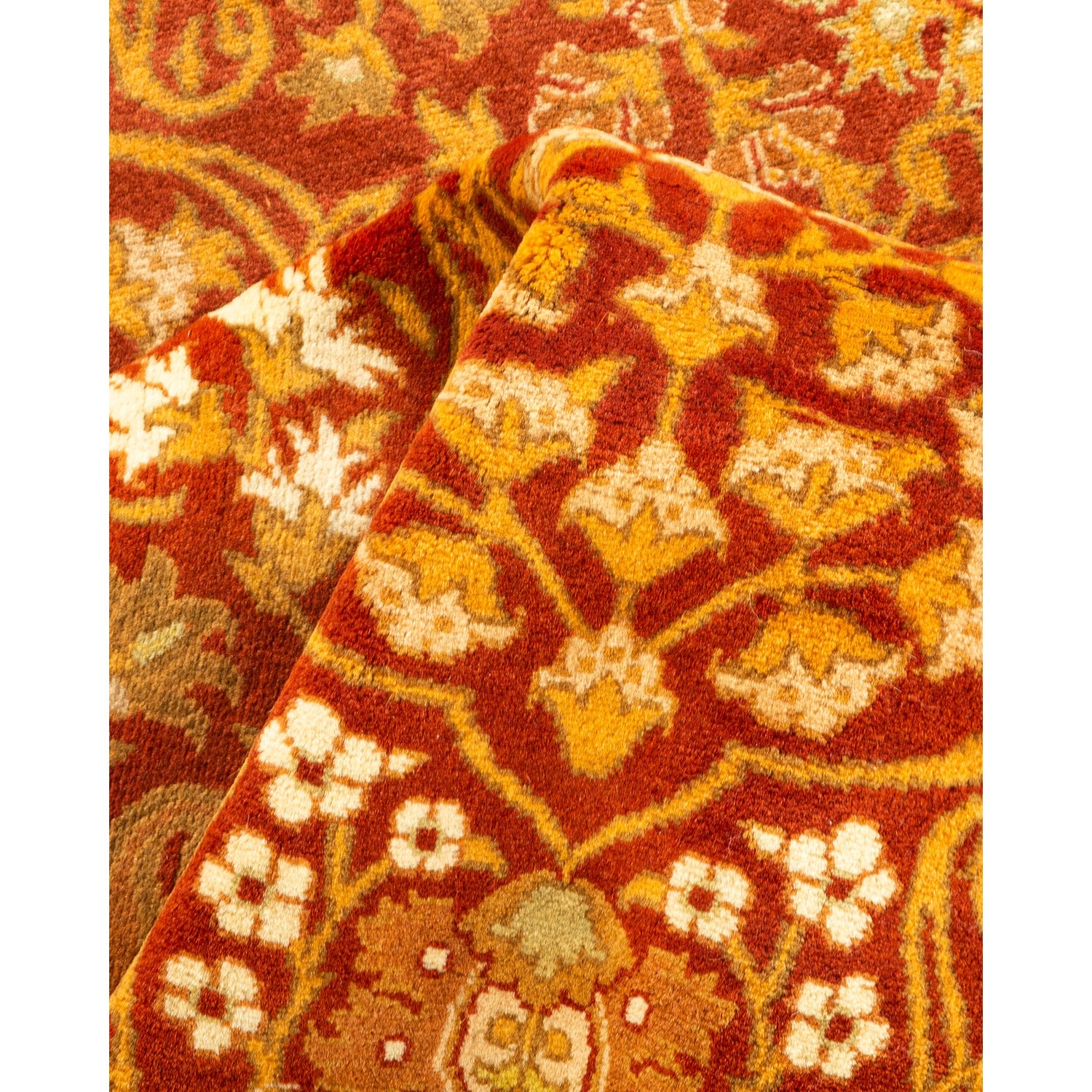 Detailed close-up of a richly patterned, plush oriental rug.