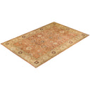 An intricate, warm-toned oriental rug featuring traditional Persian-inspired designs.