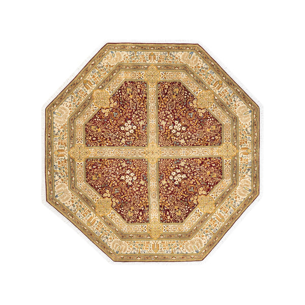 Intricately designed octagonal rug with rich red center and borders.