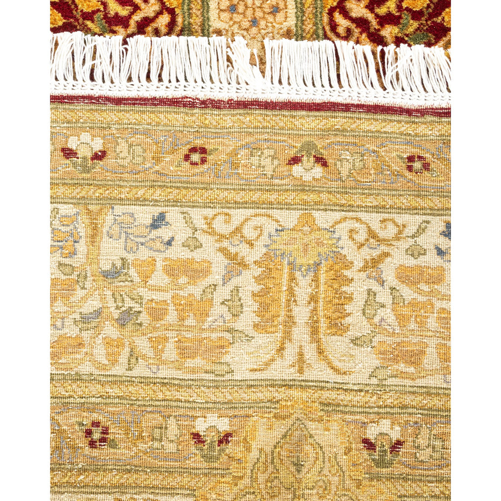 Exquisite hand-woven rug displays intricate floral and geometric motifs.