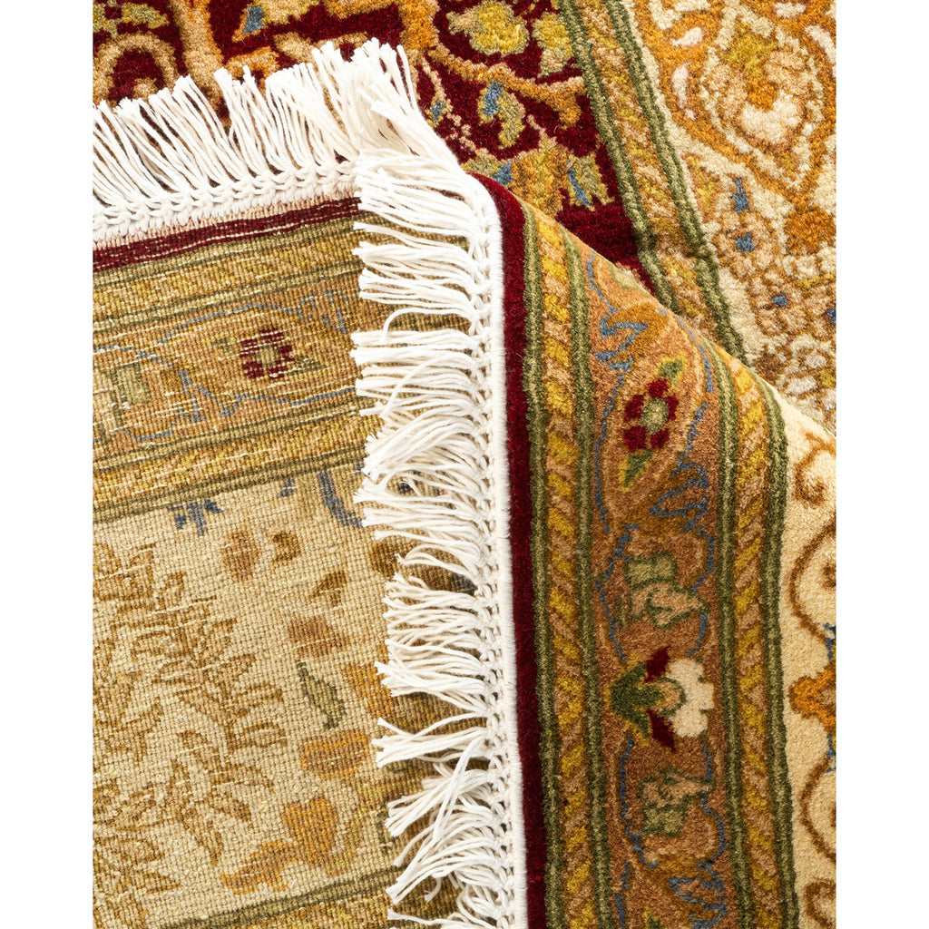 Close-up of two ornate rugs showcasing diverse patterns and craftsmanship