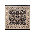 Intricately designed handmade rug with floral and geometric patterns displayed.