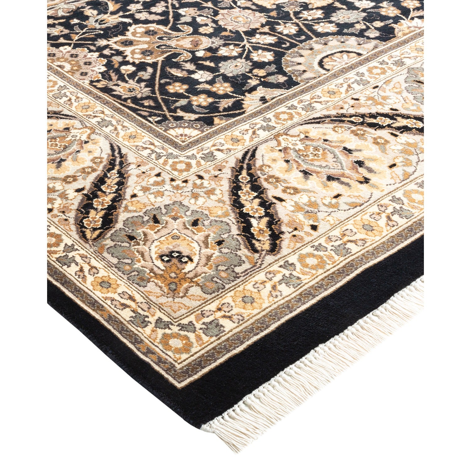 Folded ornate area rug showcasing symmetrical floral designs on dark background.