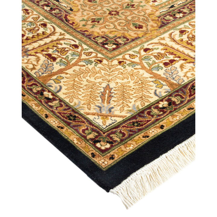 Ornate traditional area rug with elaborate floral motif and rich colors.